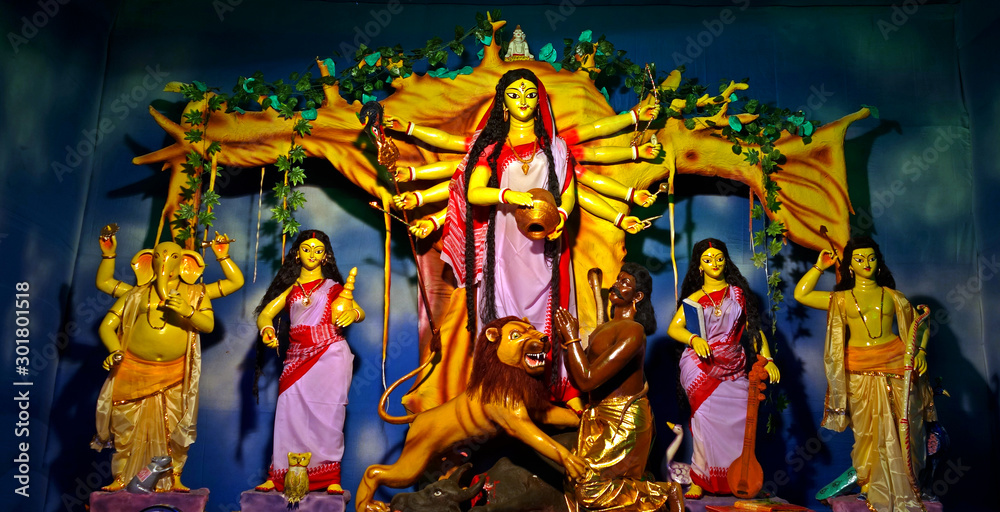 portraiture of hindu goddess durga and other gods and goddess worshiped by devotees on  the traditional festival of 'durga puja'