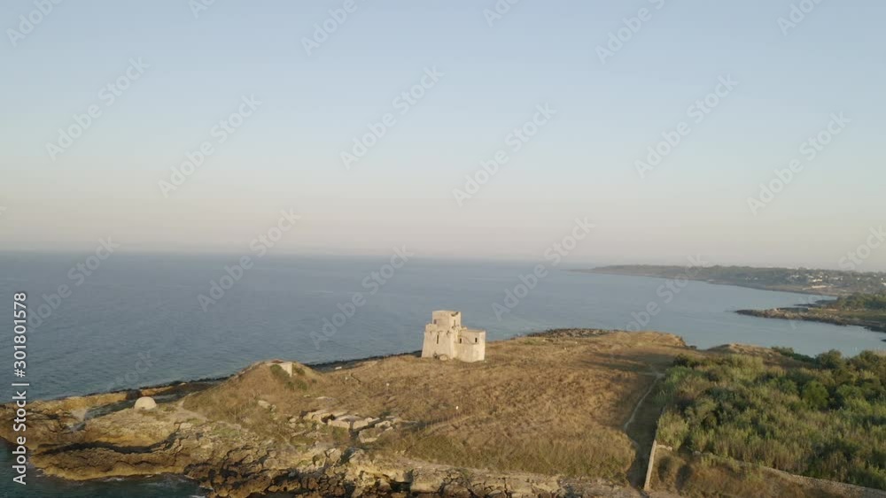 Aerial shot of coastline with a small castle on the beach, Puglia. Italy Aerial shot of coastline with a small castle on the beach, Puglia. Italy