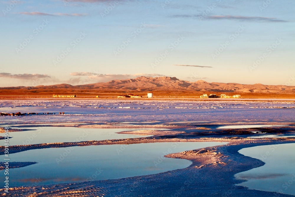 Small waterholes in the Salar de Uyuni at sunrise, Bolivia 