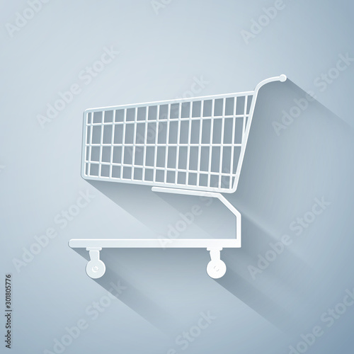 Paper cut Shopping cart icon isolated on grey background. Online buying concept. Delivery service sign. Supermarket basket symbol. Paper art style. Vector Illustration