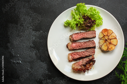 beef steak fried grill (delicious meat, sliced ​​portion serving, roast rare) menu concept. food background. copy space. Top view