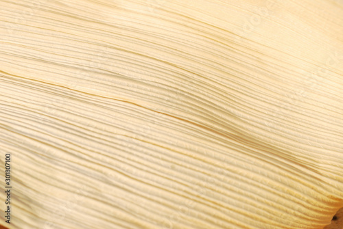 Cream colored stripes surface is caused by corn husk.