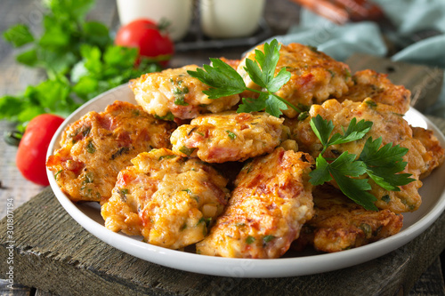 Papier peint Chicken meatballs with minced meat with tomatoes in a bowl on a wooden rustic table