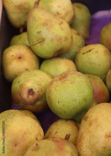 pears on display in a market stall