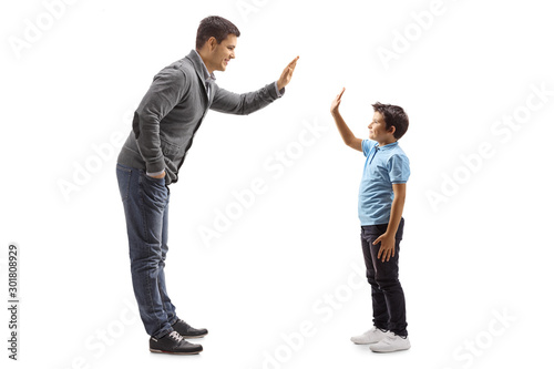 Father and son gesturing high-five