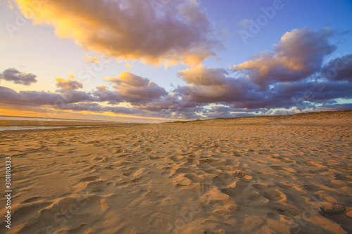 Sand dune on beach at sunsetas for nature background