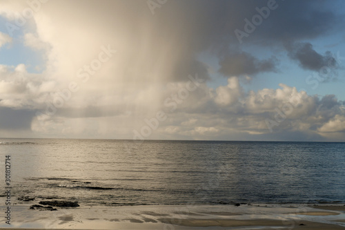 rain and clouds over the sea