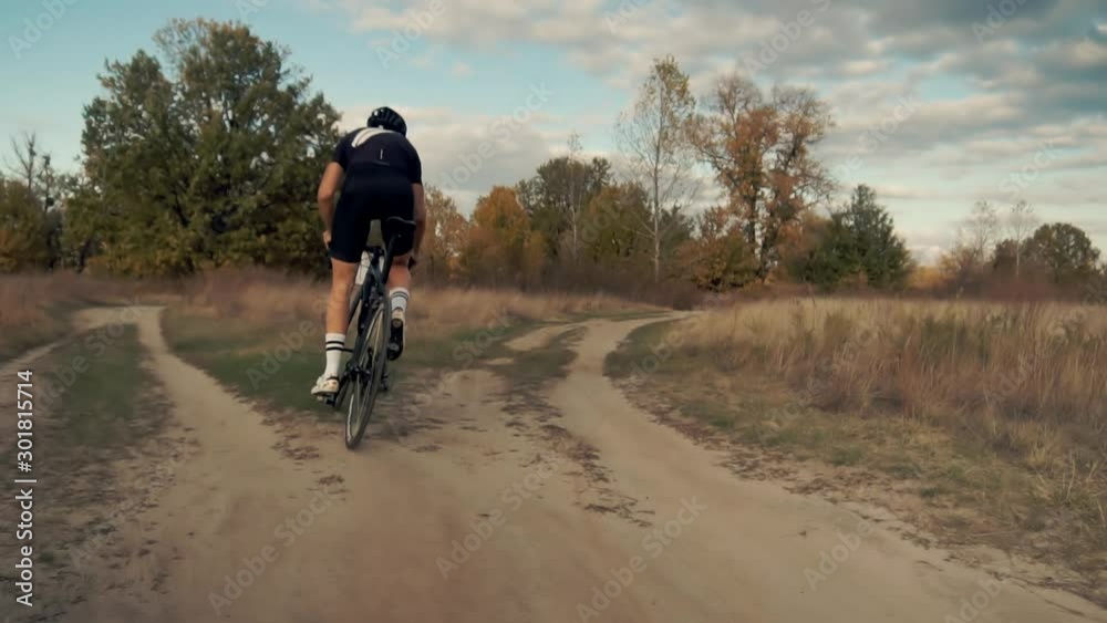 Cyclist Twists Pedals And Riding On Road Bicycle.Cycling Athlete At Fall Sunset On Park.Gear System Road Bicycle And Bike Wheel Rotation.Close-Up Cyclist Pedaling On City Park At Autumn.Sport Concept Cyclist Twists Pedals And Riding On Road Bicycle.Cycling Athlete At Fall Sunset On Park.Gear System Road Bicycle And Bike Wheel Rotation.Close-Up Cyclist Pedaling On City Park At Autumn.Sport Concept