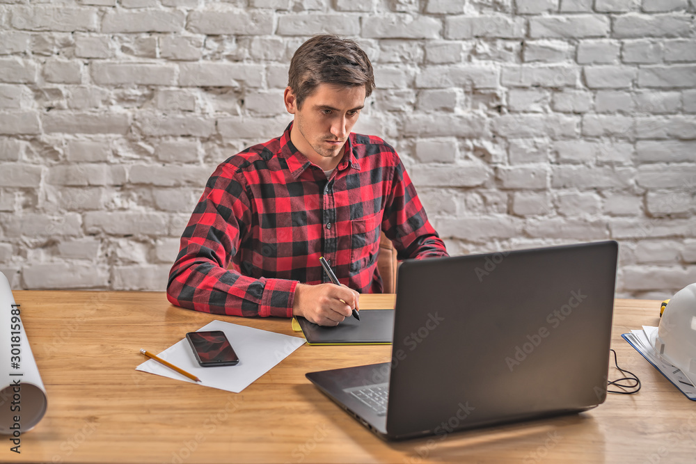 civil engineer at his Desk working with documents civil engineer at his Desk working with documents