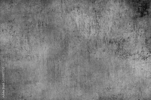 Old gray concrete wall with dirty dark damage.