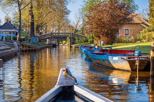 Peaceful landscape boating a beautiful Dutch canal,  Giethoorn, Netherlands