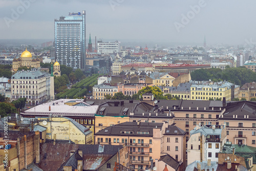 Aerial view of beautiful buildings of Riga Old Town from Saint Peter's  church on cloudy, foggy and rainy day, Riga, Latvia. Soft selective focus