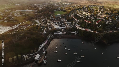 Cinematic Aerial of Potree City,Capital of Isle of Skye Island, Scotland UK. Cityscape and Marina in Loch photo