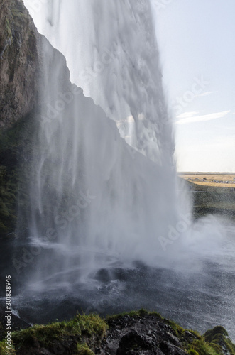 amazing Seljalandfoss waterfall in sunny autumn day  Iceland. Famous tourist attraction