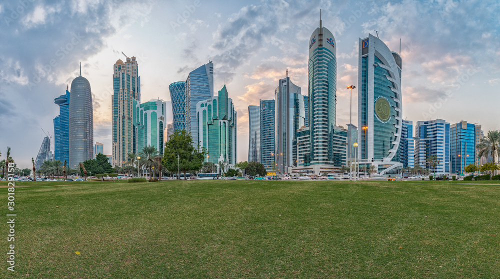 Doha skyline in West bay district daylight view with clouds in the sky and no people