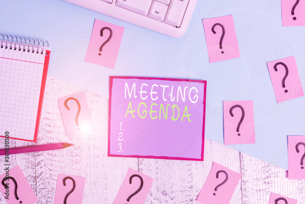 Handwriting text Meeting Agenda. Conceptual photo items that participants hope to accomplish at a meeting Writing tools, computer stuff and math book sheet on top of wooden table Handwriting text Meeting Agenda. Conceptual photo items that participants hope to accomplish at a meeting Writing tools, computer stuff and math book sheet on top of wooden table