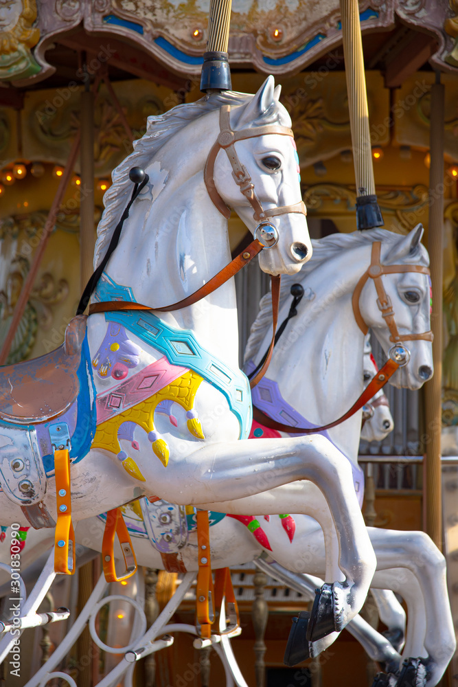 white horses of old carrousel
