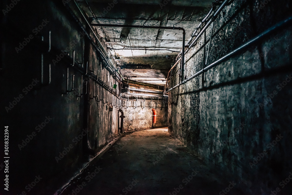 scary abandoned industrial corridor with pipes Stock Photo | Adobe Stock