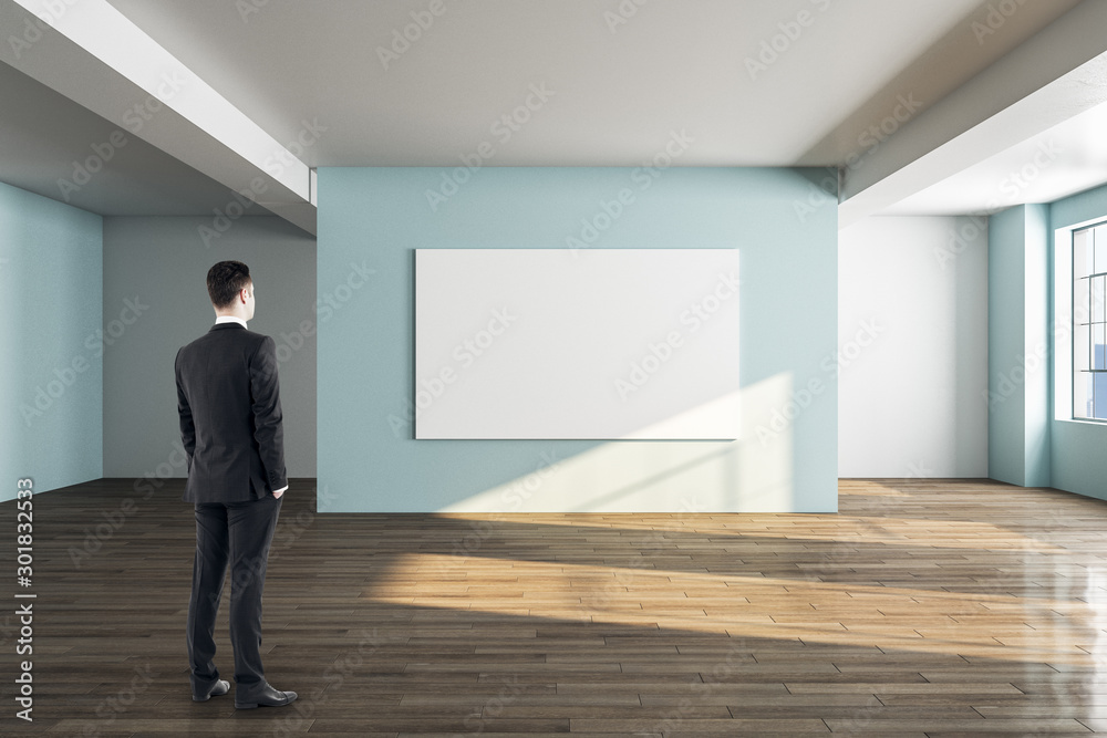 Businessman looking at empty banner Businessman looking at empty banner