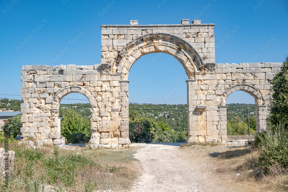 The monumental gate is at the end of the north-south colonnaded street, on the west side of the Temple of Zeus Olbios. The Temple of Zeus of Diokaesareia ( Uzuncaburc ) Ancient City in Mersin, Turkey