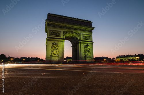 The Arc de Triomphe de l'Étoile illuminated at night, Paris