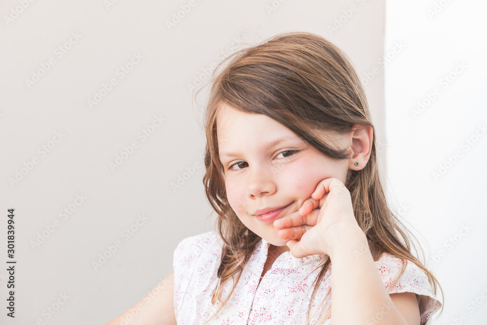 Smiling little Caucasian girl, close-up face portrait Smiling little Caucasian girl, close-up face portrait
