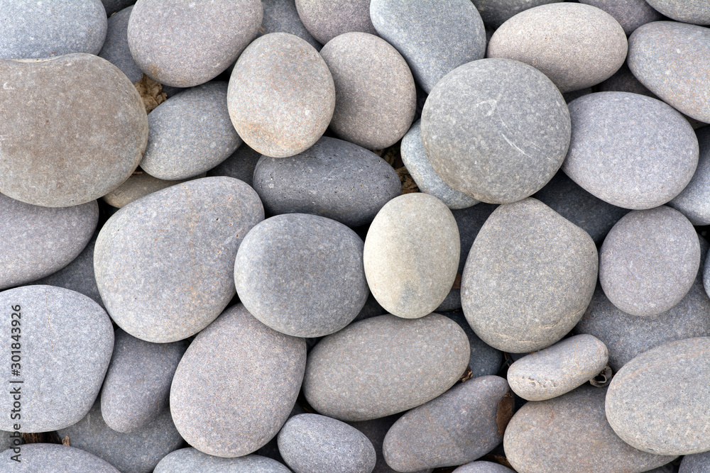 Naklejka Small stones in various shades of gray.