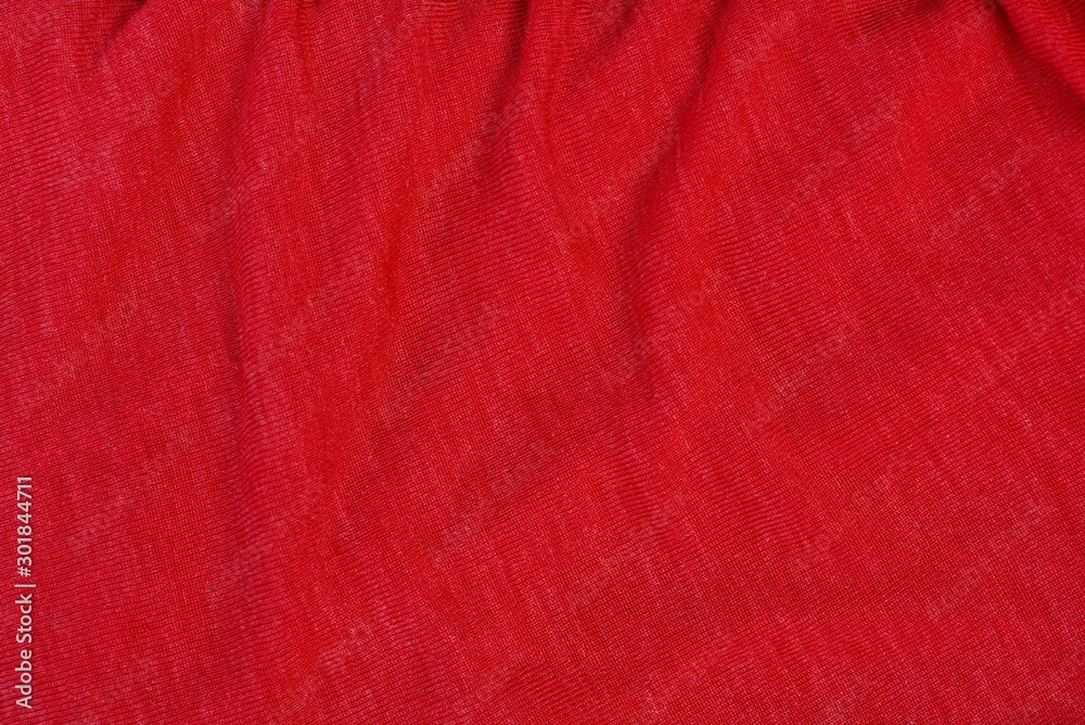 bright red background from a piece of crumpled fabric - obrazy, fototapety, plakaty 