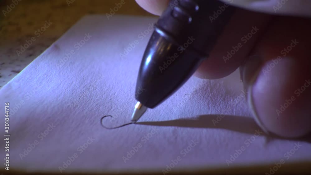 write a love letter with a pen on paper, close-up, macro