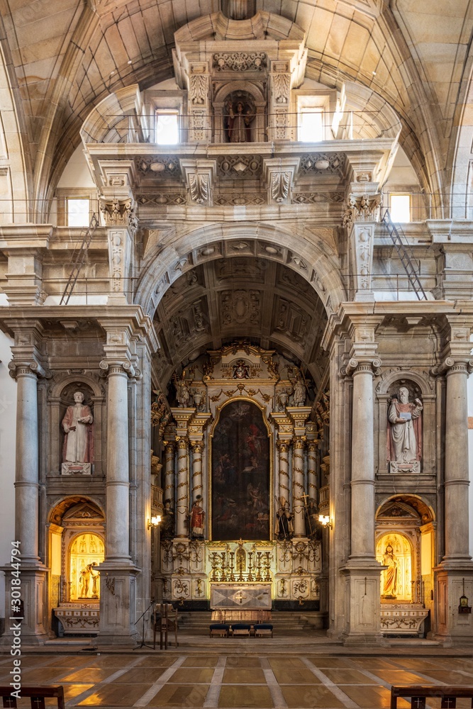 The majestic interior decorations of the Sao Lourenco church in Porto, Portugal.