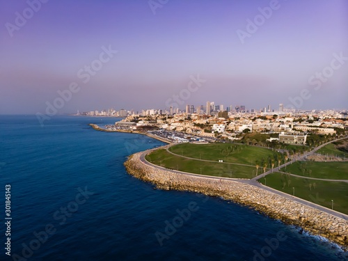 Tel Aviv skyline off the shore of the Mediterranean sea - Aerial photo. View from Midron Yaffo Park for Old Jaffa and Tel aviv in background. photo