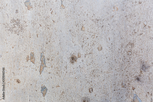 Old grungy cracked concrete wall paint peeling off background