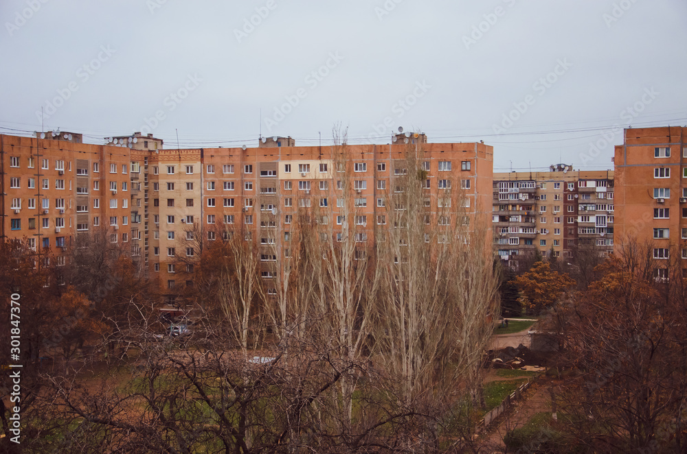 Fototapeta premium Multi-storey panel house, old. Houses of the USSR, roof, stairs, communications. Black and white vintage photo.