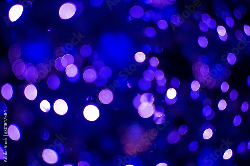 The glare of the holiday lights. Festive Christmas background.