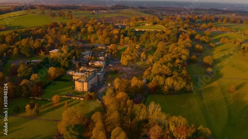 Aerial footage of Autumn Fall colours at Sunset around a Bretton Hall, a beautiful Georgian Country House near Wakefield, UK