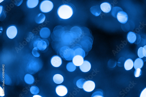The glare of the holiday lights. Festive Christmas background.