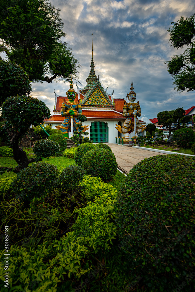 Guardians at the gate to the Ordination Hall. Temple of Dawn. Bangkok, Thailand