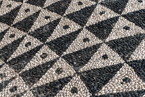 Fototapeta Naklejka Na Ścianę i Meble -  Decorative pebble mosaic on the streets of Rhodes. Greece