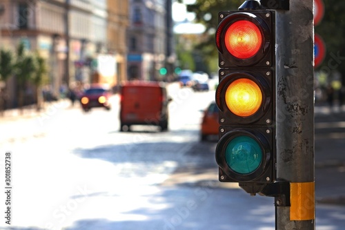  Traffic light  on the crossroad. Red and yellow light