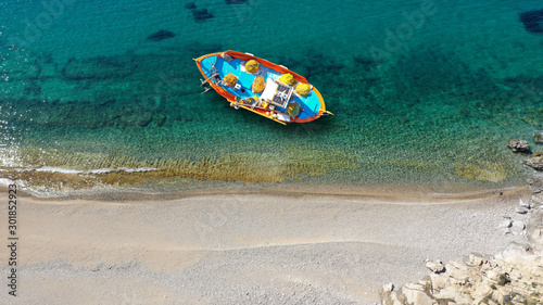 Aerial drone top down photo of traditional fishing boat near famous beach of Vagia, Serifos island, Cyclades, Greece