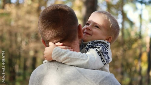 Wallpaper Mural Son hugging loving daddy. Young father with boy. Happy and fun to be together Torontodigital.ca