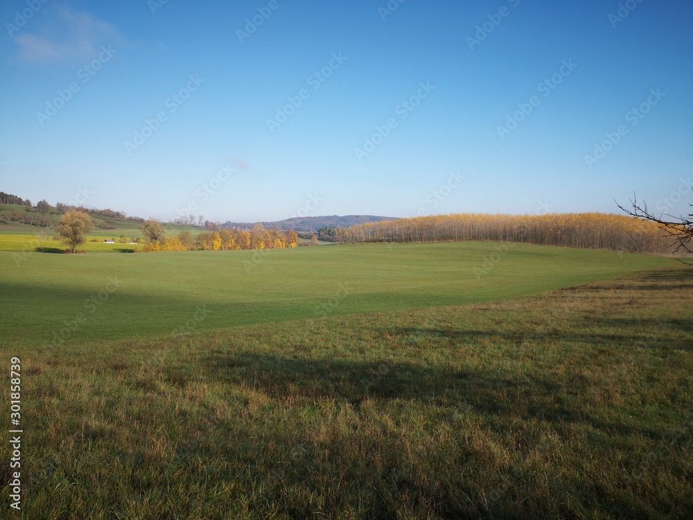 landscape with autumn hill and blue sky