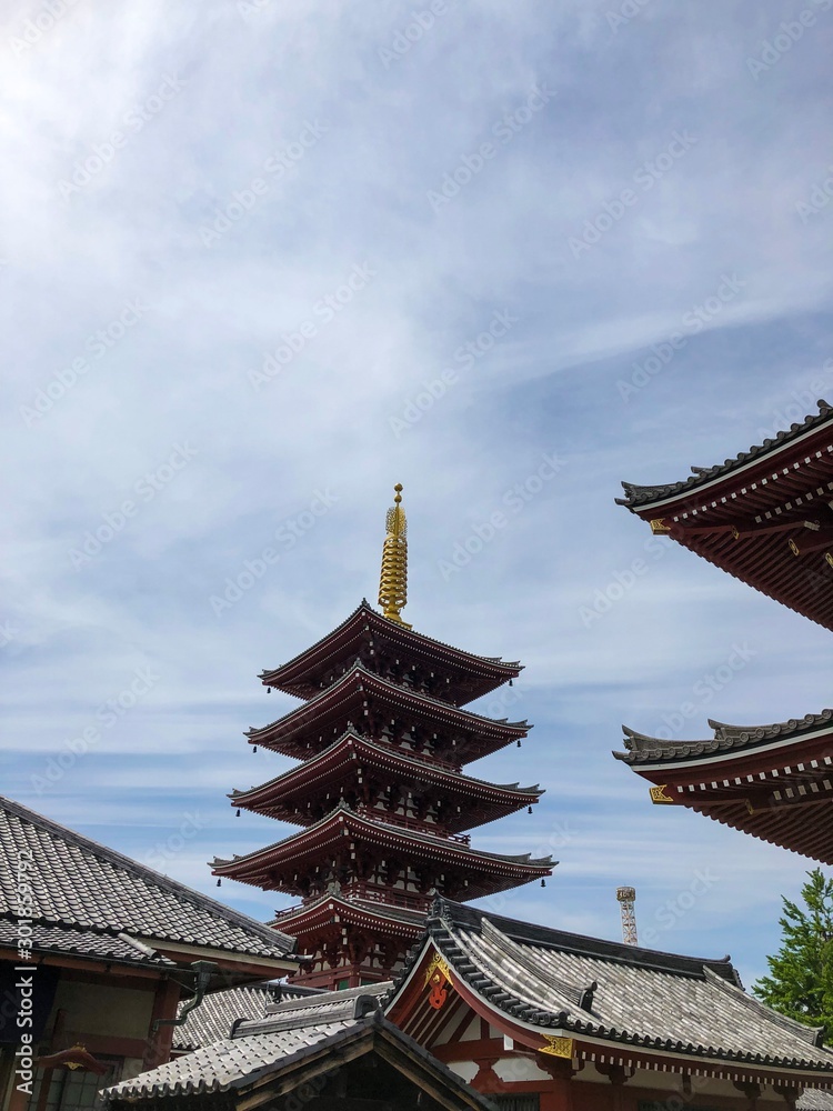 The most famous shrine in Tokyo, Sensoji Temple and its five storied pagoda. Picture taken on a beautiful sunny day. The most famous shrine in Tokyo, Sensoji Temple and its five storied pagoda. Picture taken on a beautiful sunny day.