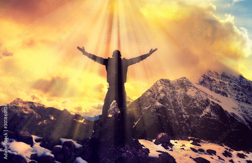Ταπετσαρία Man Praying With Arms Open On Epic Mountain Top Summit With Light Shining With A