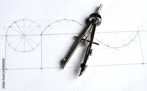 vintage classic drafting drawing: compass over sinusoid draw scheme photo