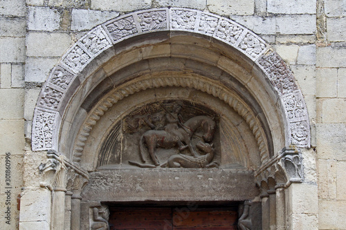 la lunetta del portale della chiesa romanica di San Giorgio nel borgo di Vigoleno (Piacenza) photo