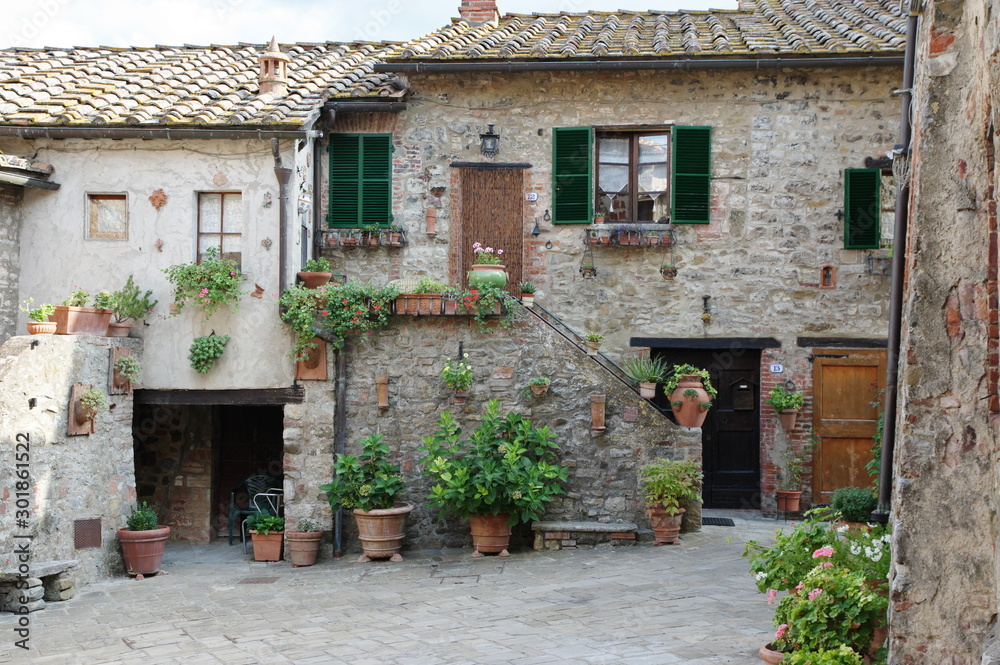 San Gusme, Tuscany, Italy - October 17, 2019: medieval village which is preserved in its original form until today. Typical buildings.