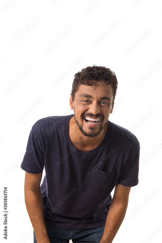 portrait of latin dark skin man looking at camera and laughing. Standing against white background. portrait of latin dark skin man looking at camera and laughing. Standing against white background.