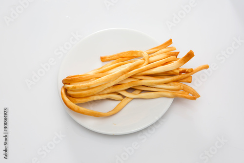 Polish traditional cheese oscypek - Oscypek isolated on white.  Oscypek on a plate.