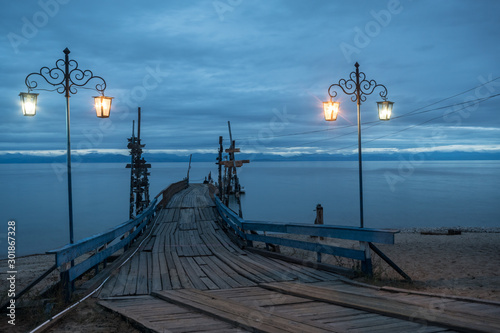 Wooden pier of the sanatorium Khakusy. Northern Baikal region photo